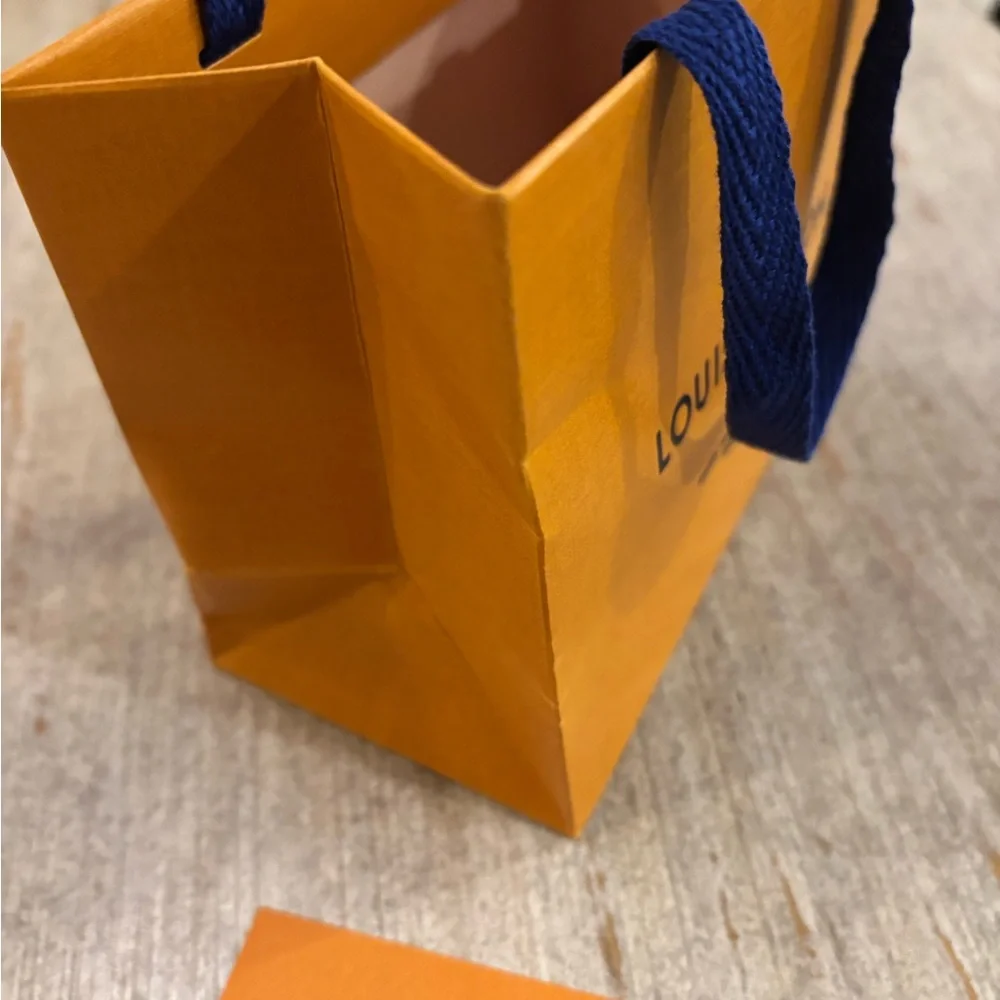 Louis Vuitton Vibrant Orange Bag with Blue Handles